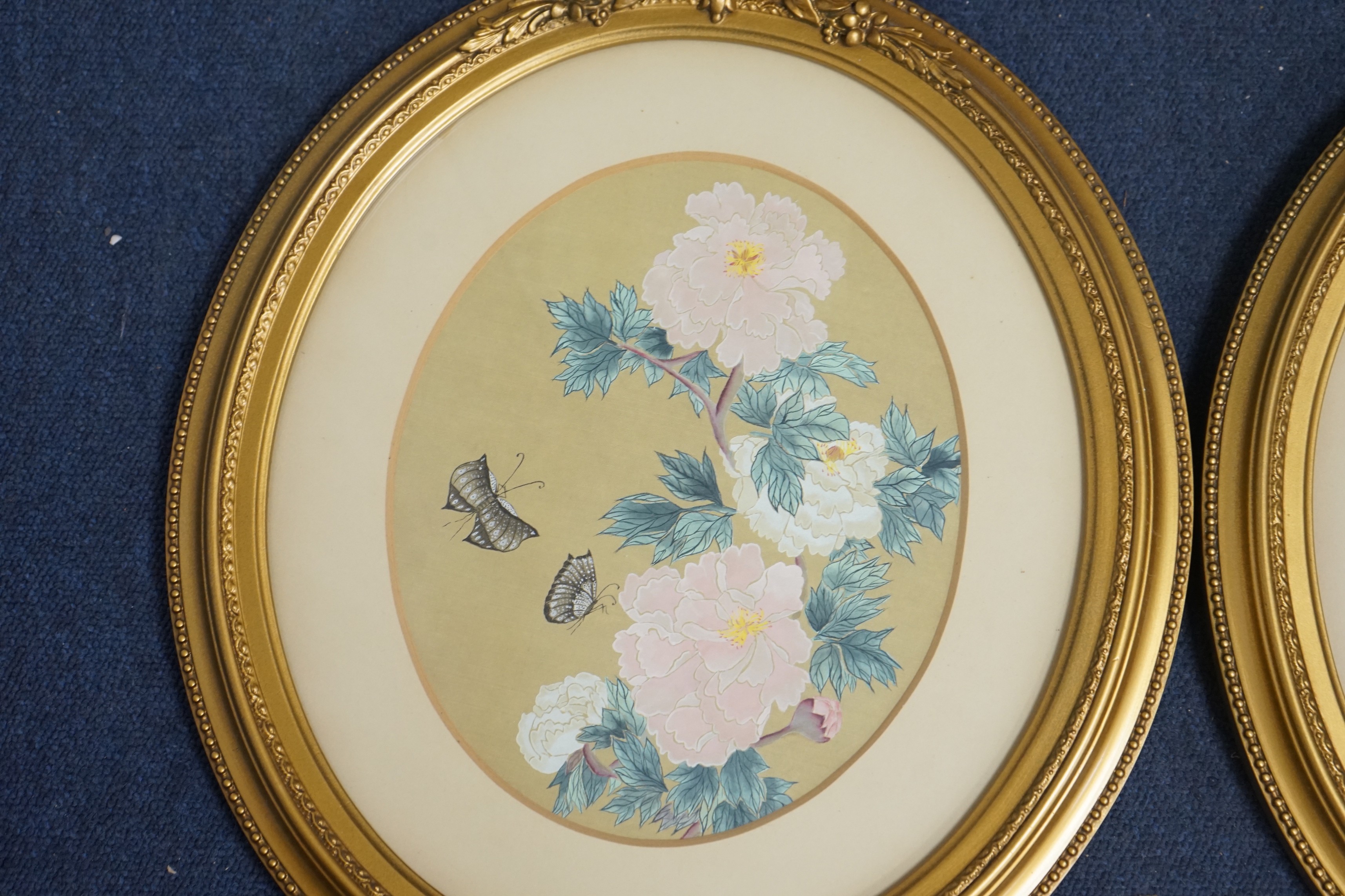 Chinese School, pair of watercolours on silk, Studies of flowers and butterflies, 25 x 20cm, oval